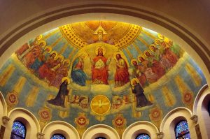 1024px-St._Benedict_Parish_(Terre_Haute,_Indiana),_interior,_detail_of_apse_mural,_the_Trinity_and_the_Heavenly_Court